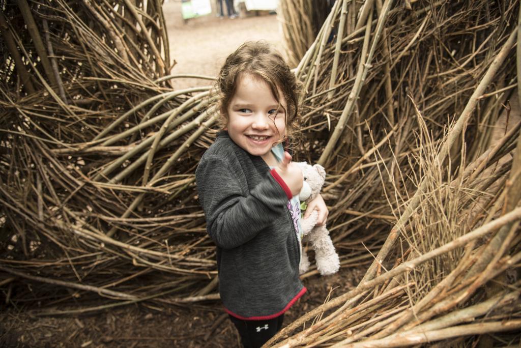 A girl enjoying Stickwork at Pease Park in Austin, Texas