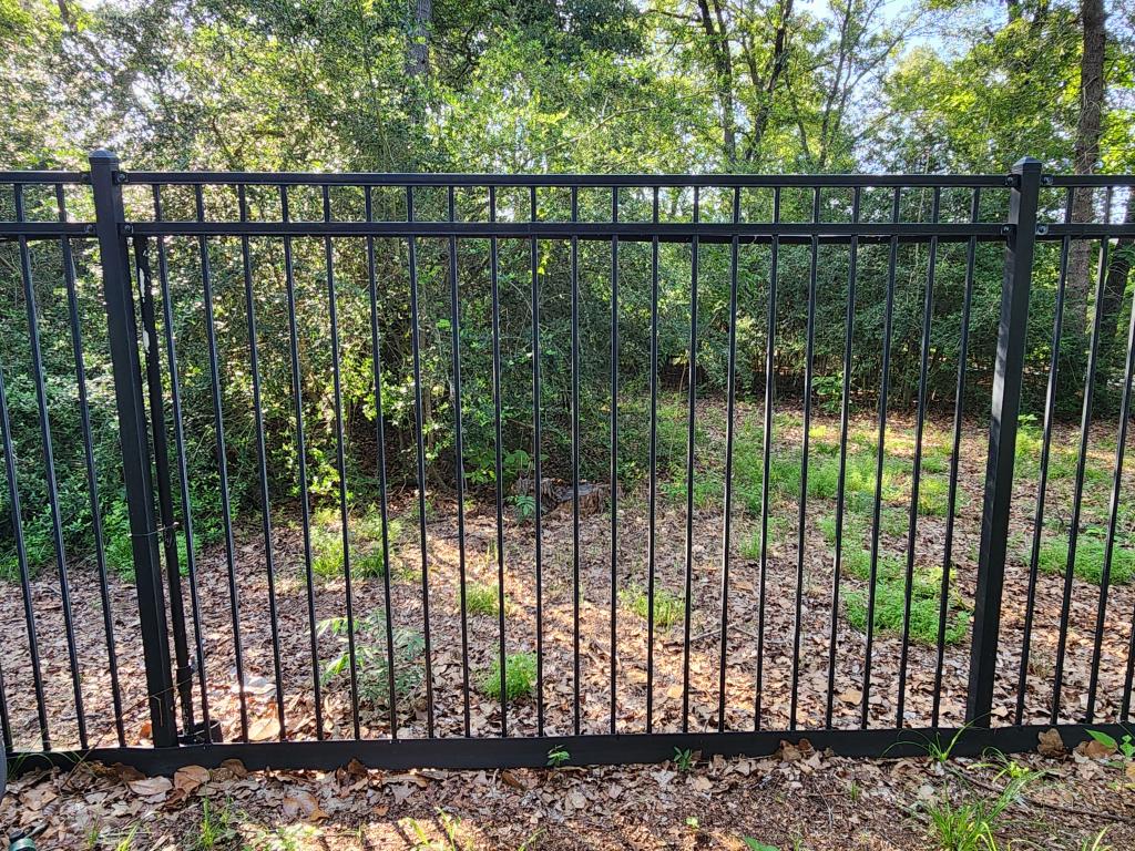 black metal fence with flat top