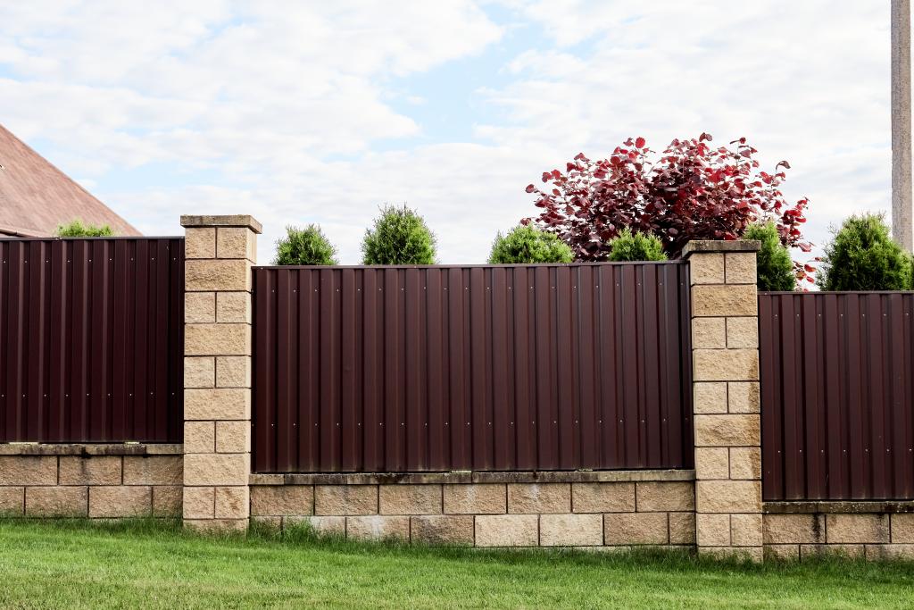 metal and brick fence sloped downhill