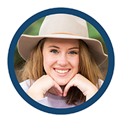 Ava, a teenage girl with light brown hair and blue eyes, wearing taupe floppy-brimmed hat