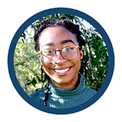 Sheridan, a teenage girl with black braided hair, wearing glasses and a blue turtleneck