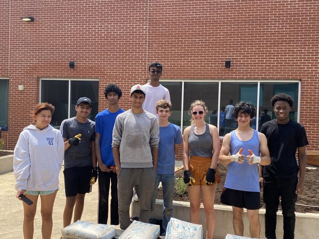 eight mcneil high school students at McNeil High School after a volunteer work day