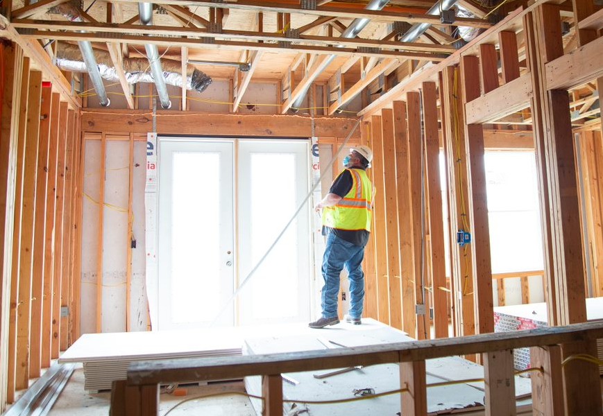 worker inspecting a building