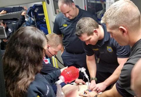 Paramedics conducting cpr