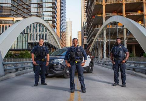 3 officers and patrol car on downtown bridge