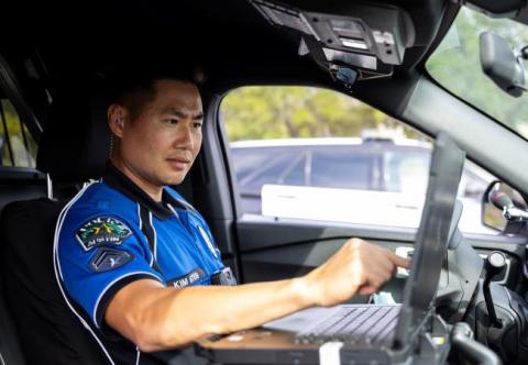 Police officer in patrol car