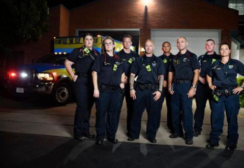 Paramedics in front of the station