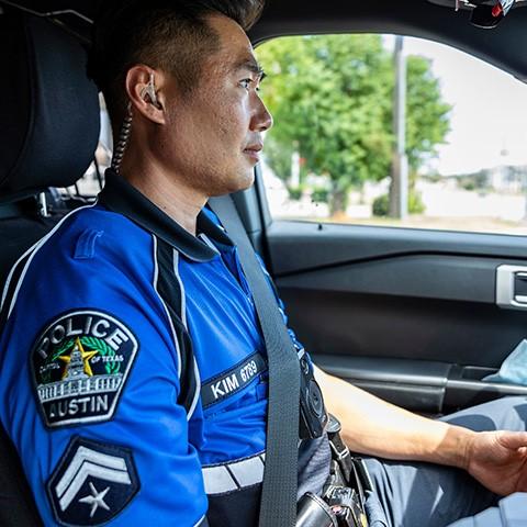 Corporal T. Kim in patrol car