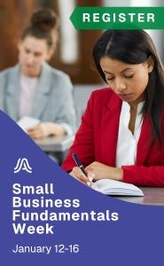 photograph of two women writing in a notebook