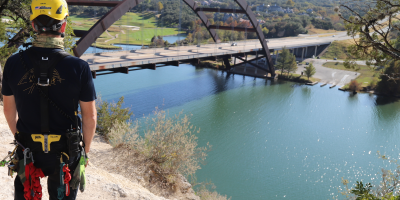 Firefighter standing next to Pennybacker Bridge