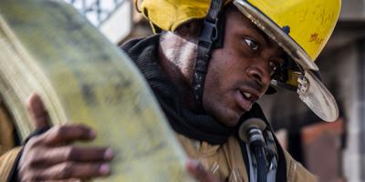 Firefighter carrying a bundle