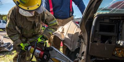 Firefighter using jaws of life