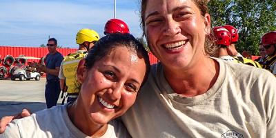 Two female firefighters training