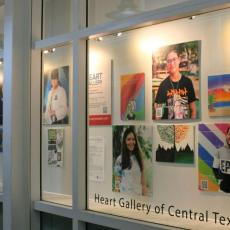 The Heart Gallery art installation at AUS features photo portraits of adoptable children next to their own original art work.