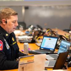 An ATCEMS Commander works in the EOC