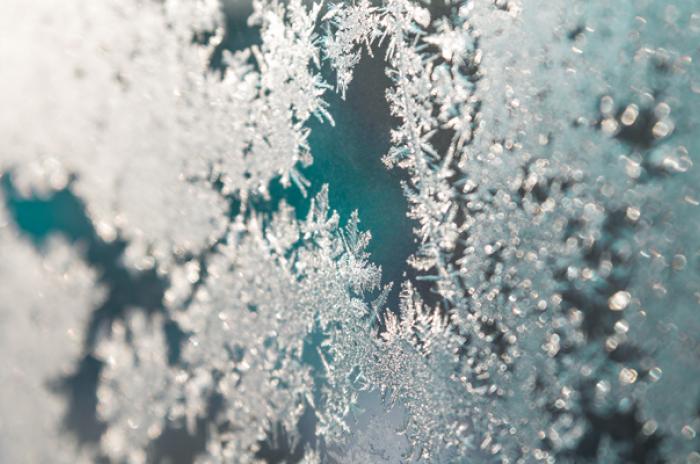 A photo showing frost on a pane of glass.