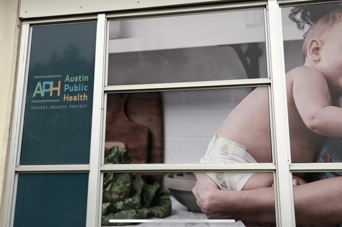 Austin Public Health Building with image featuring a baby.