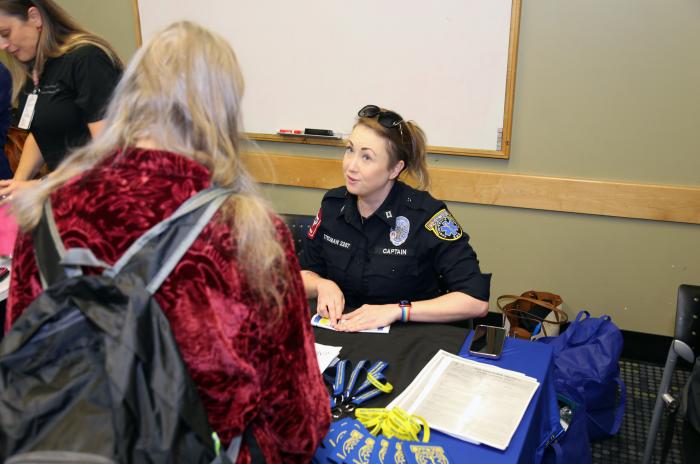 A photo of community members meeting with first responders at an Emergency Preparedness Pop-up event.
