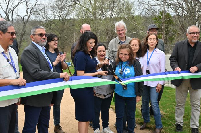 Council Member Fuentes, City of Austin Officials and community members ceremonially cut a ribbon at the greenbelt entrance.