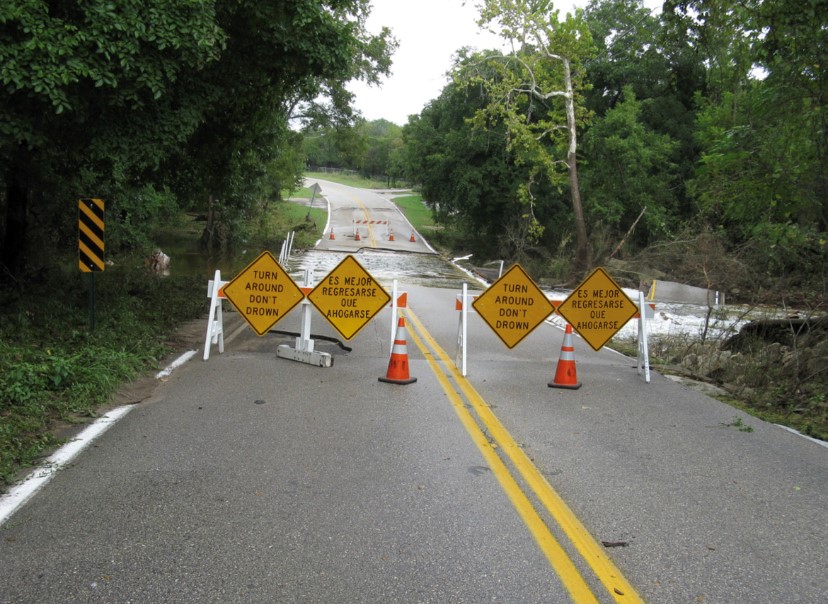 Flooded road with barricade