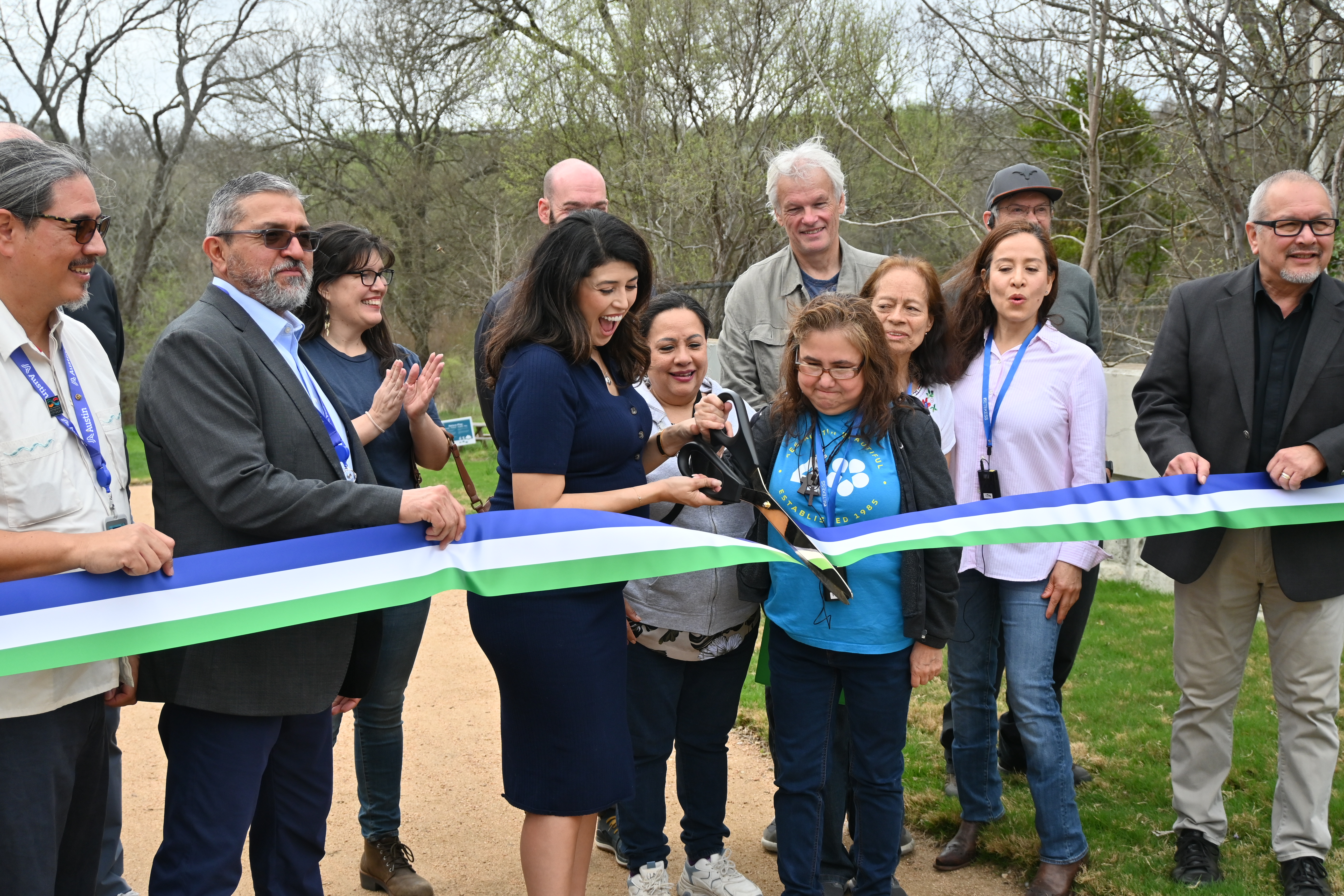 Council Member Fuentes, City of Austin Officials and community members ceremonially cut a ribbon at the greenbelt entrance.